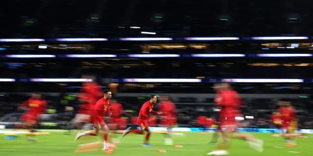 Liverpool warm up before playing Tottenham