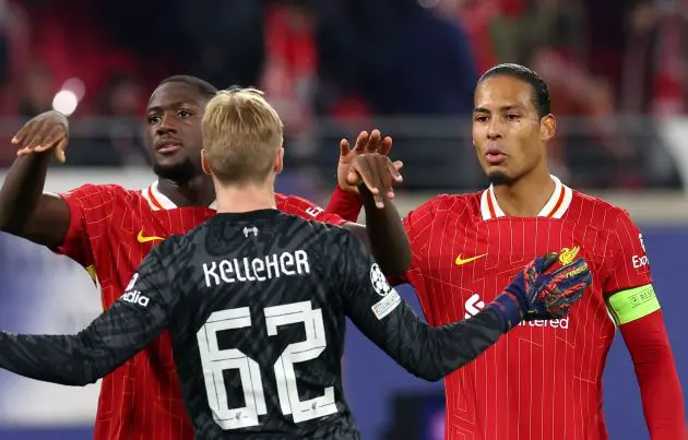 Ibrahima Konate celebrates with Liverpool teammates Virgil van Dijk and Caoimhin Kelleher.