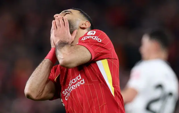 Mo Salah covers his face during Liverpool v Fulham at Anfield.