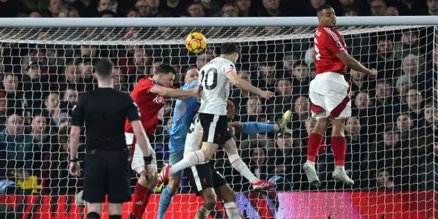 Chris Kavanagh watches on as Diogo Jota scores for Liverpool