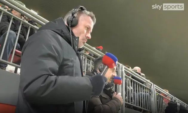 Jamie Carragher watching the Liverpool v Man United game at Anfield.