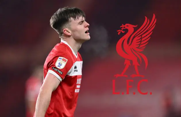 Ben Doak looks frustrated next to Liverpool club crest.