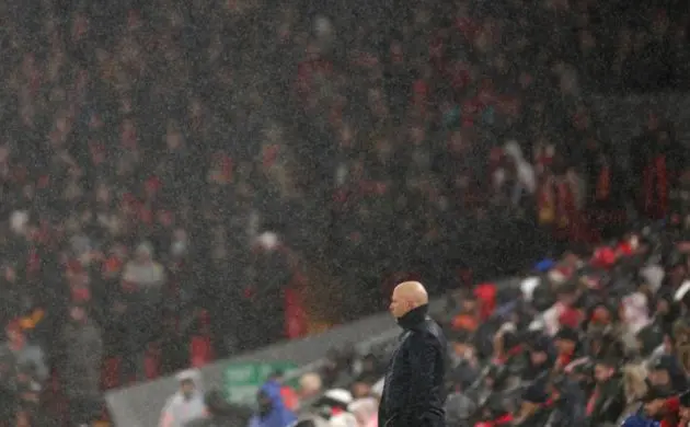 Arne Slot watches on from the touchline