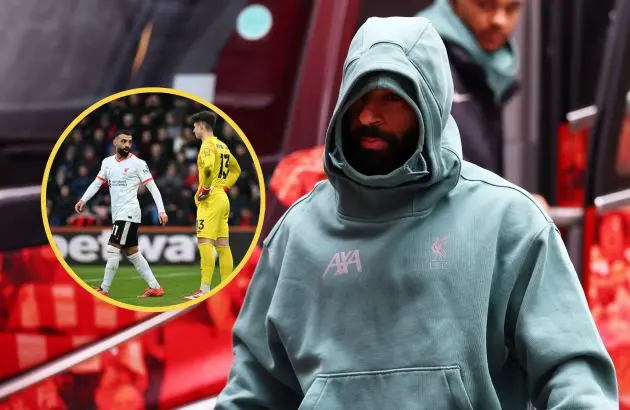 A hooded Mo Salah walks off Liverpool team bus.