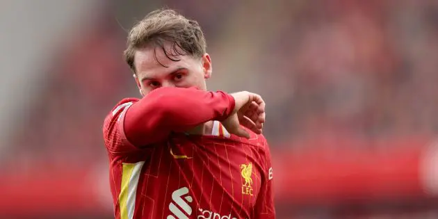 Alexis Mac Allister playing for Liverpool at Anfield