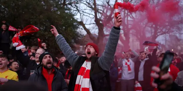 Liverpool fans sing before a game at Anfield