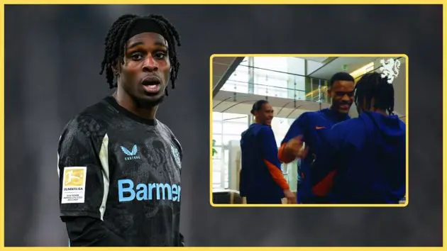 Jeremie Frimpong looks out next to picture of him greeting Ryan Gravenberch and Virgil van Dijk.