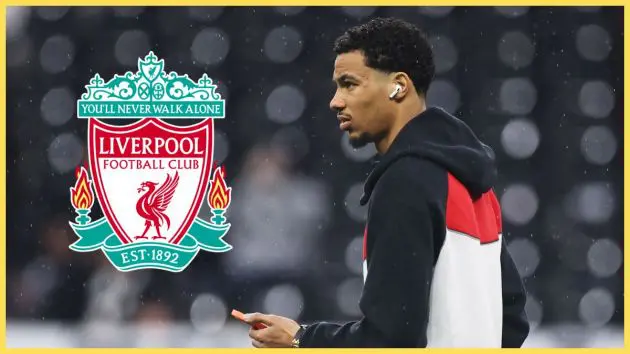 Hugo Ekitike holds his phone and looks at Liverpool club crest.