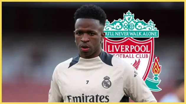 Vinicius Jr stands in Real Madrid training shirt in front of Liverpool club crest.