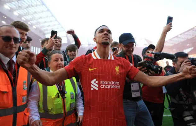 Trent Alexander-Arnold celebrates with Liverpool ball boy at Anfield.