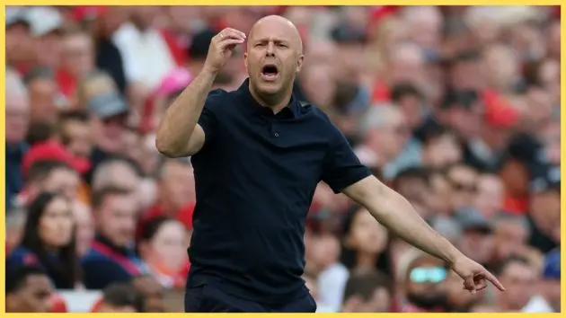 Liverpool head coach Arne Slot gestures with his hands from the sideline.