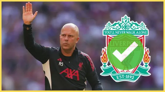 Arne Slot waves his hand next to Liverpool club crest.