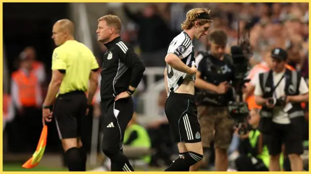 Anthony Gordon leaves the pitch after his red card against Liverpool