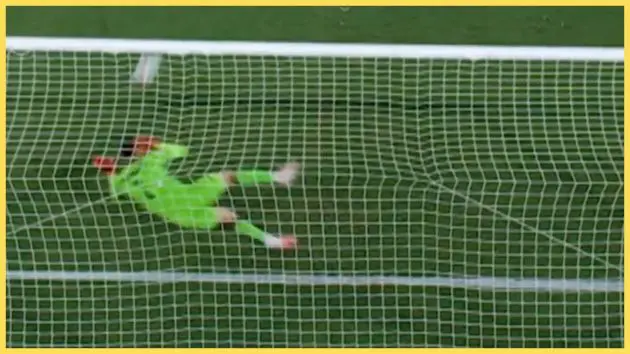 Giorgi Mamardashvili saves a penalty from Ferran Torres