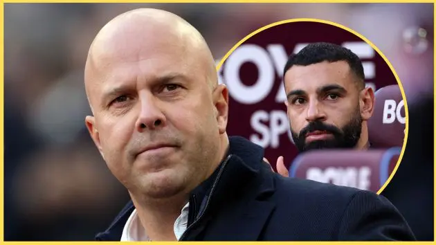 Arne Slot looks on as Mo Salah watches from the bench.