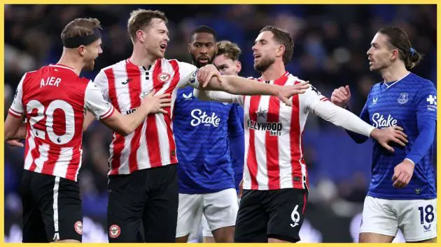 Jordan Henderson and Nathan Collins of Brentford clash with Jack Grealish of Everton