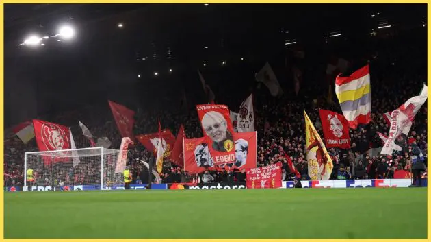 Liverpool fans wave flags in the Kop prior to a Champions League fixture