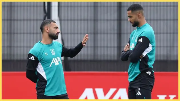 Mohamed Salah and Cody Gakpo of Liverpool FC talk during a training session at AXA Melwood Training Centre