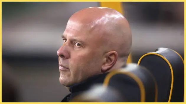 Arne Slot looks over his shoulder from the Wolves bench.