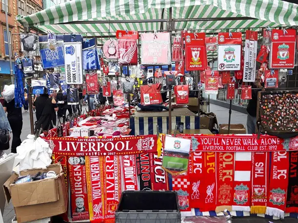 Market stall in Liverpool selling Liverpool FC merchandise