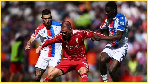 Alexis Mac Allister of Liverpool is challenged by Daniel Munoz and Ismaila Sarr of Crystal Palace during the Premier League match between Liverpool and Crystal Palace at Anfield