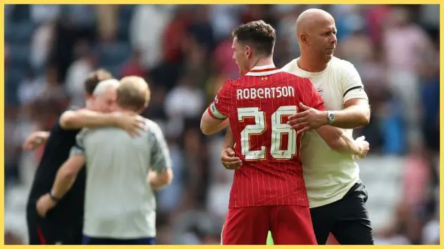 Arne Slot, Manager of Liverpool, hugs Andy Robertson after the pre-season friendly match between Preston North End and Liverpool at Deepdale
