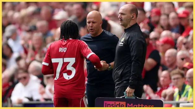 Rio Ngumoha speaks to Arne Slot on the touchline at Liverpool game.