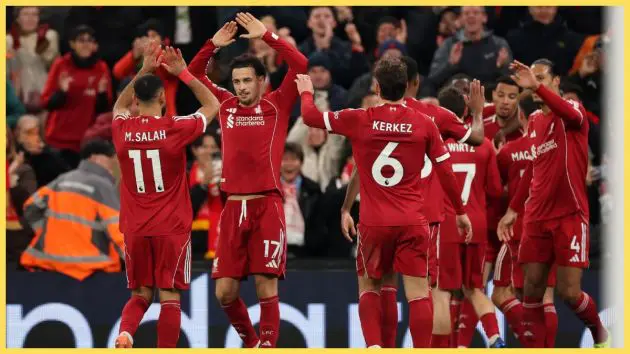 Mohamed Salah of Liverpool celebrates with teammate Curtis Jones after Hugo Ekitike scored his team's second goal during the Premier League match between Liverpool and Brighton & Hove Albion at Anfield