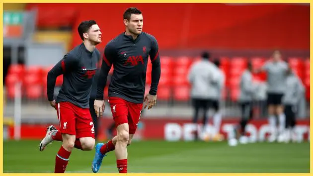Andy Robertson and James Milner (R) of Liverpool warm up prior to the Premier League match between Liverpool and Fulham at Anfield
