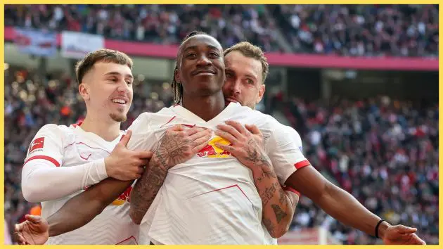 Liverpool-linked winger Yan Diomande is mobbed by teammates in celebration.