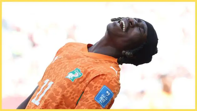 Liverpool and PSG transfer target Yan Diomande leans back and screams in frustration.