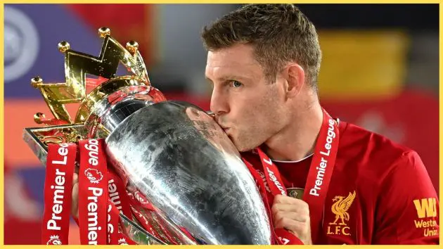 James Milner kisses the Premier League trophy after Liverpool's triumph in 2020