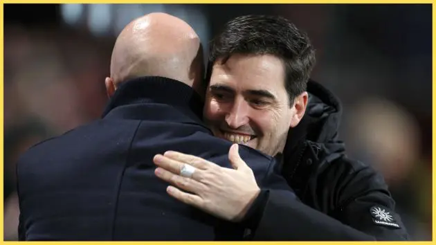 Andoni Iraola and Arne Slot embrace after a match between Bournemouth and Liverpool