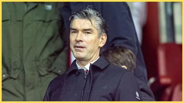 Liverpool sporting director Richard Hughes looks on.