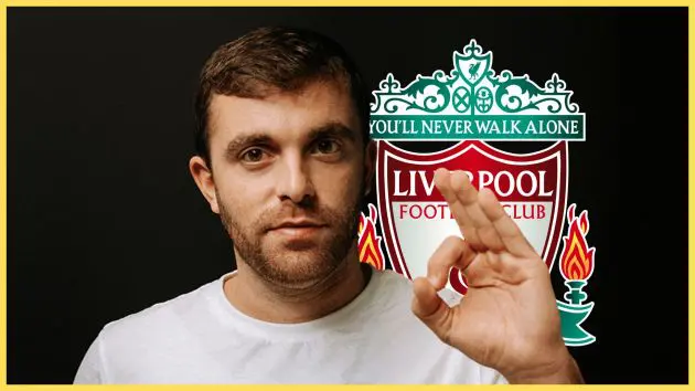 Transfer news expert Fabrizio Romano makes an ok sign with his hand in front of Liverpool club crest.