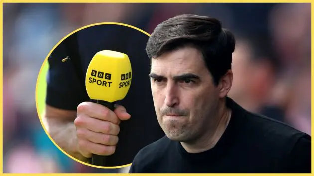 Liverpool manager Andoni Iraola looks tight-lipped next to BBC Sport microphone.