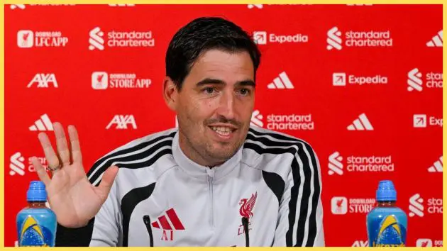Liverpool manager Andoni Iraola waves his hand during press conference.