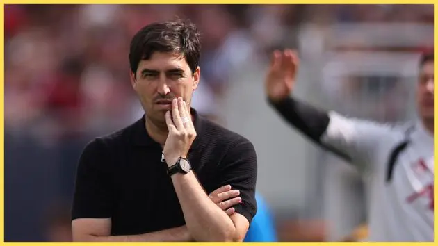 Liverpool manager Andoni Iraola anxiously rubs his face.