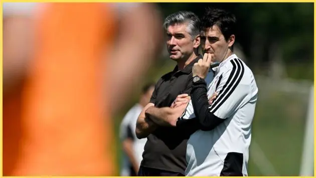 Richard Hughes and Andoni Iraola observe a Liverpool training session