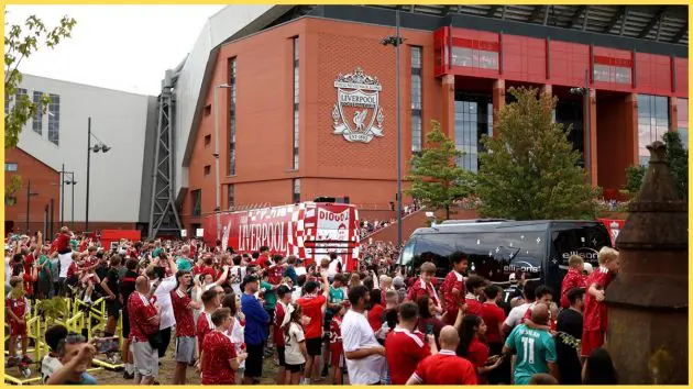 Liverpool fans greet the team bus outside Anfield