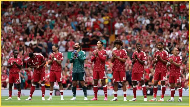 Liverpool players observe a moment's applause before kick-off